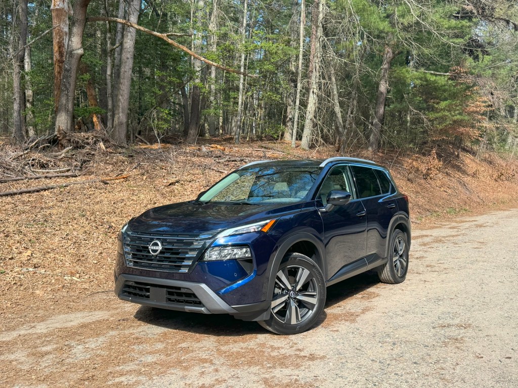 The 2024 Nissan Rogue on a dirt road