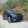 The 2024 Nissan Rogue on a gravel road