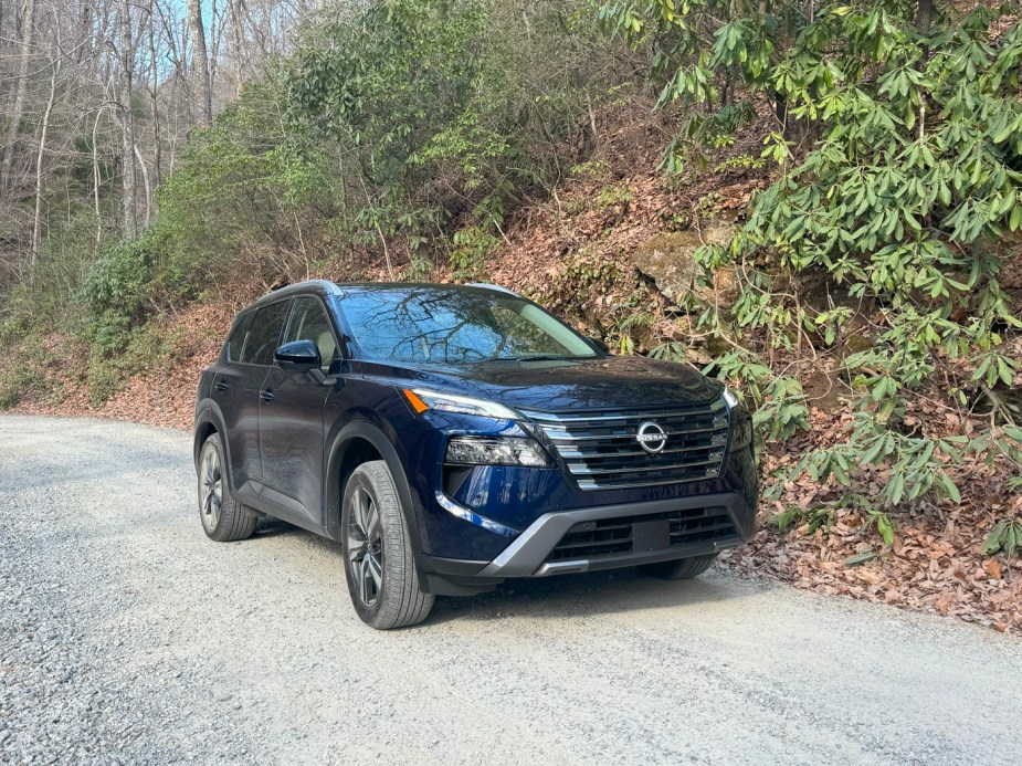 The 2024 Nissan Rogue on a gravel road