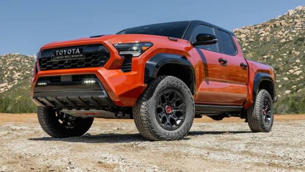 2024 Toyota Tacoma TRD Pro powered by the i-Force Max hybrid powertrain, posed.