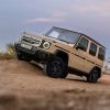 Electric Mercedes Benz G wagon SUV parked on a rock off-road