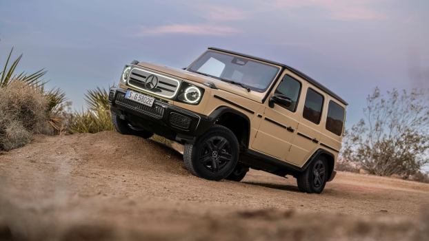 Electric Mercedes Benz G wagon SUV parked on a rock off-road