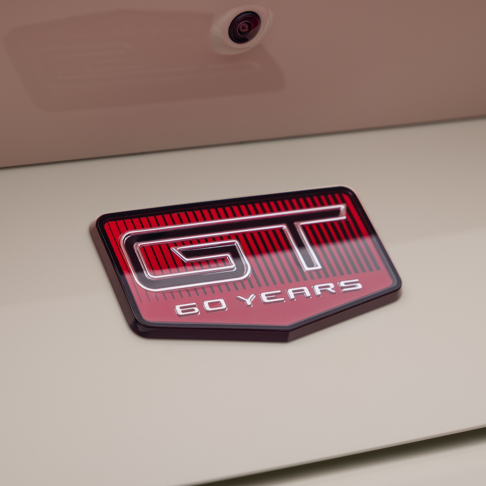 A cloisonné badge on the back of the Ford Mustang 60th Anniversary appearance package.