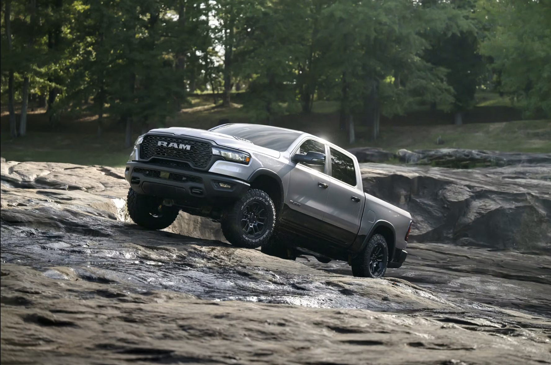 The 2025 Ram 1500 RHO climbing over rocks