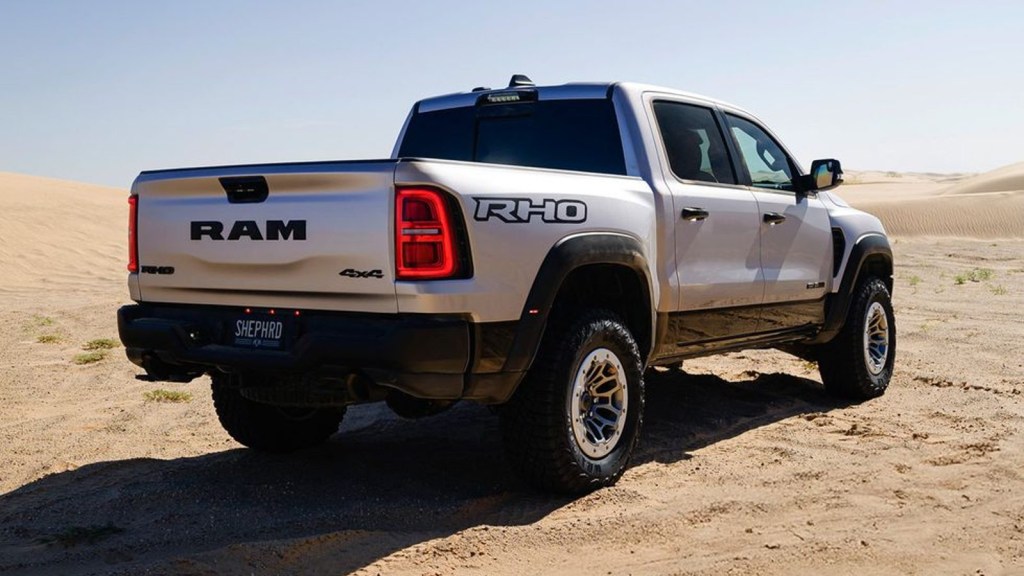 2025 Ram 1500 RHO Rear view, posed on the sand.