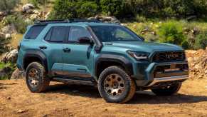 2025 Toyota 4Runner Trailhunter posed on a dirt trail.