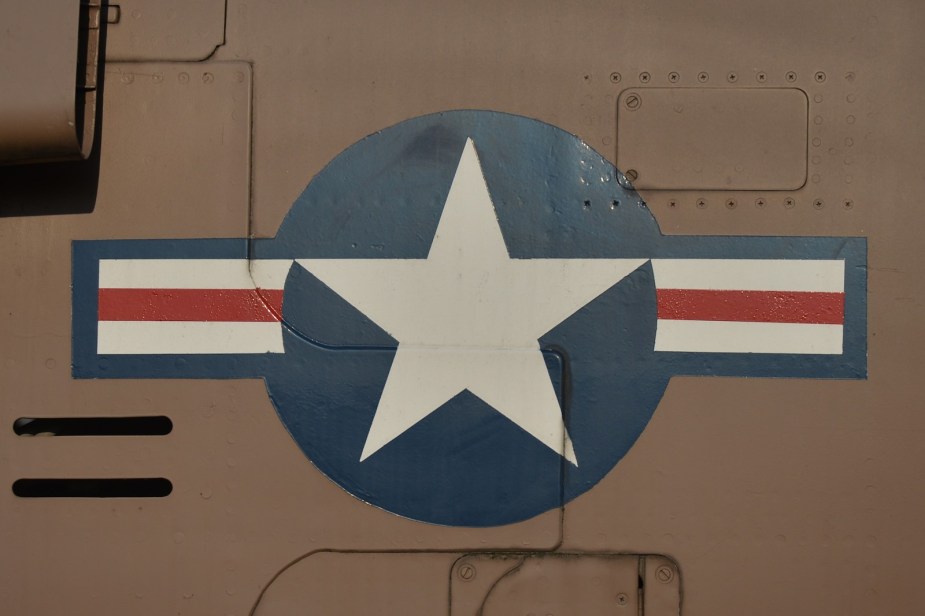 The Air Force's star insignia on the aluminum side of a plane.