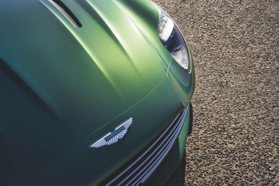 An Aston Martin DB12 'Super Tourer' car shows off its badge.