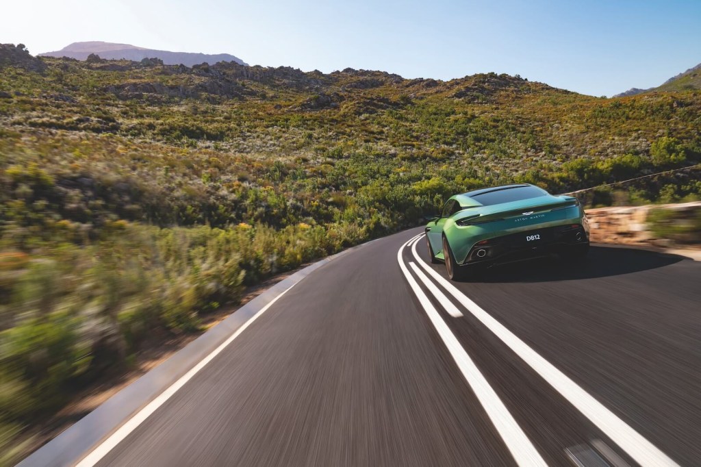 An Aston Martin DB12 'Super Tourer' car takes a corner. 