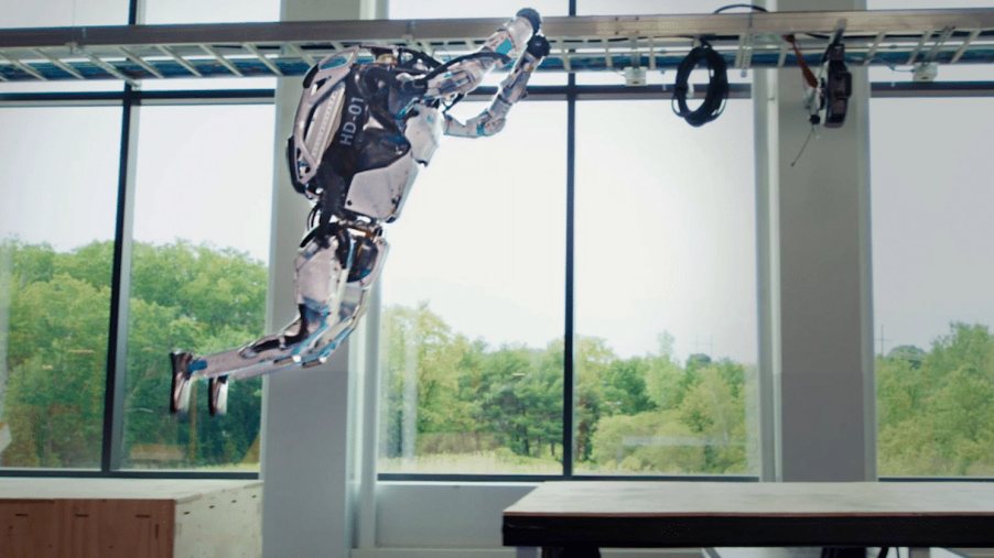Humanoid Boston Dynamics robot jumping from one platform to another.