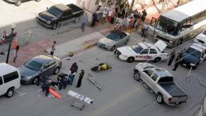 Overhead view of a crash scene with an injured motorcyclist