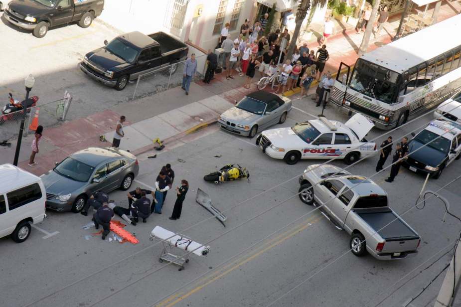Overhead view of a crash scene with an injured motorcyclist
