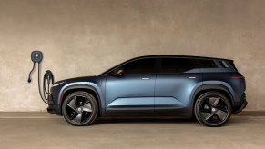 Fisker Ocean crossover SUV plugged in to its EV charger
