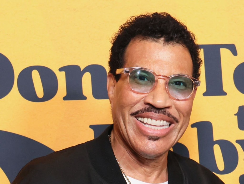 Lionel Richie getting out of his car and onto the red carpet at an event in LA