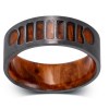 A metal ring based on the Jeep Wrangler grille with a redwood interior