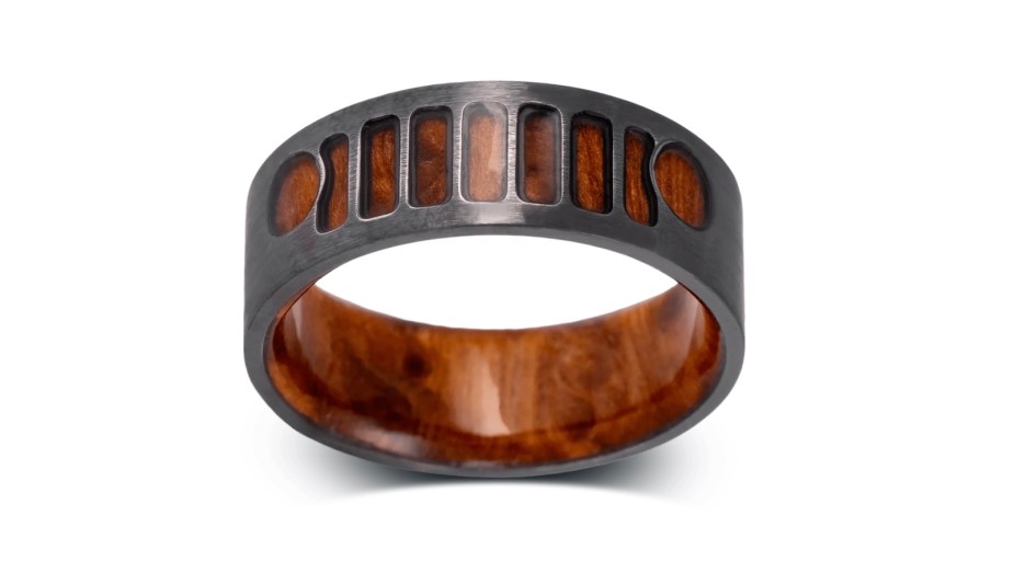 A metal ring based on the Jeep Wrangler grille with a redwood interior