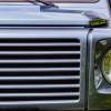 The Mercedes-Benz logo on the grille of a G-Class SUV.