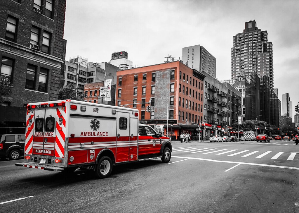 An NYFD ambulance driver pilots a rig down New York City streets. 