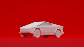 White Cybertruck model on a red background