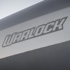 Warlock Badge from the side of a Ram 1500 pickup truck.
