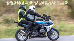 A set of riders use motorcycle airbag vests to stay safe on their bike.