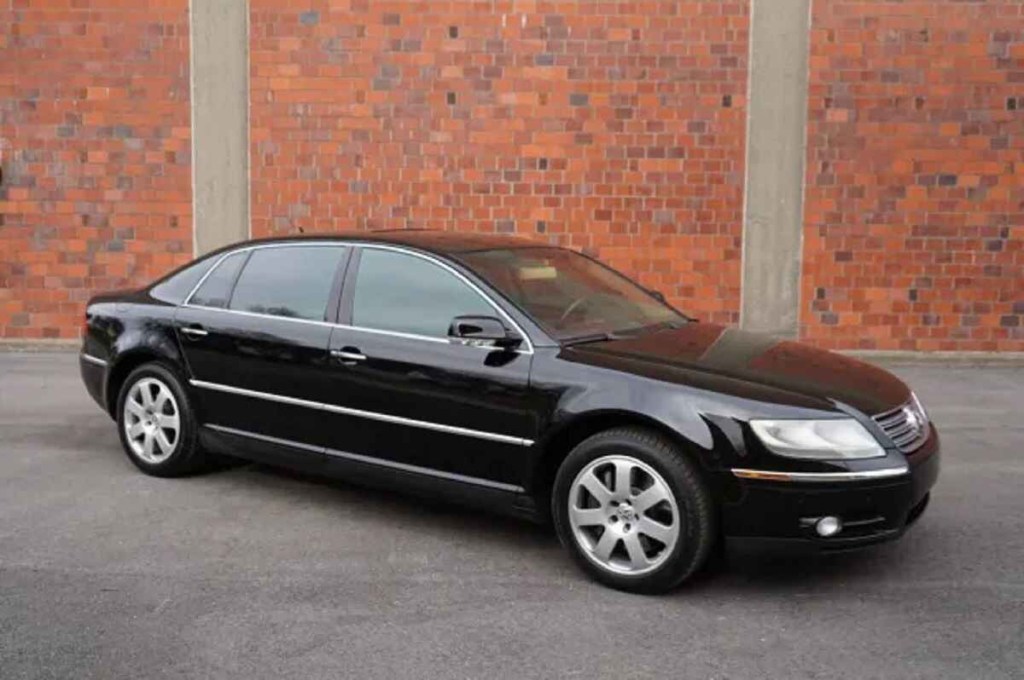 A black 2004 VW Phaeton W12 luxury sedan parked in right front angle view