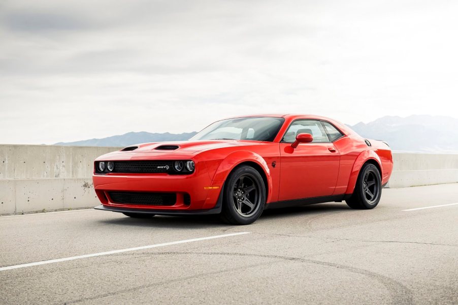 A red 2020 Dodge Challenger Super Stock parked on the highway left front angle view