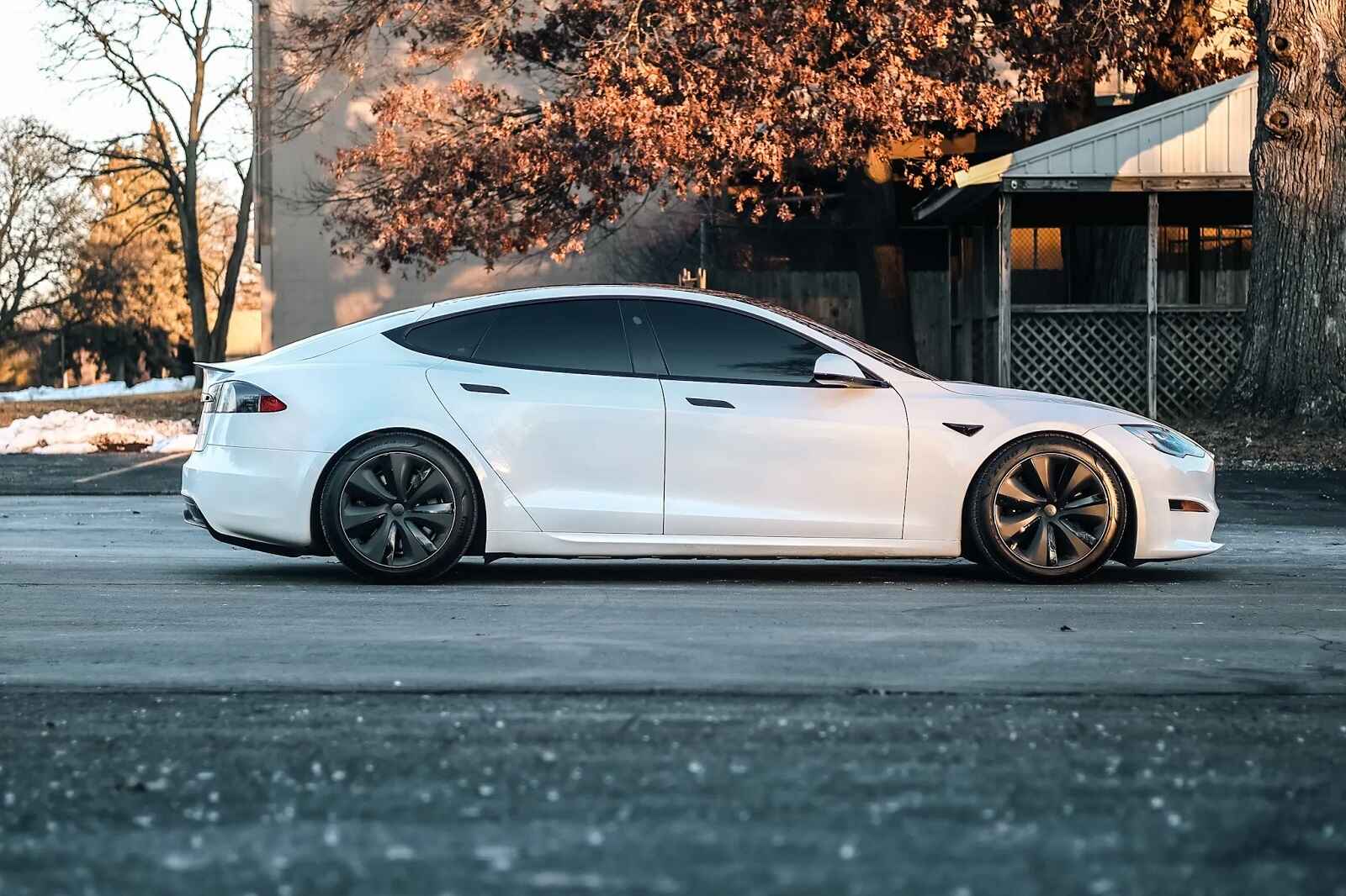 A white 2021 Tesla Model S Plaid parked in right profile view