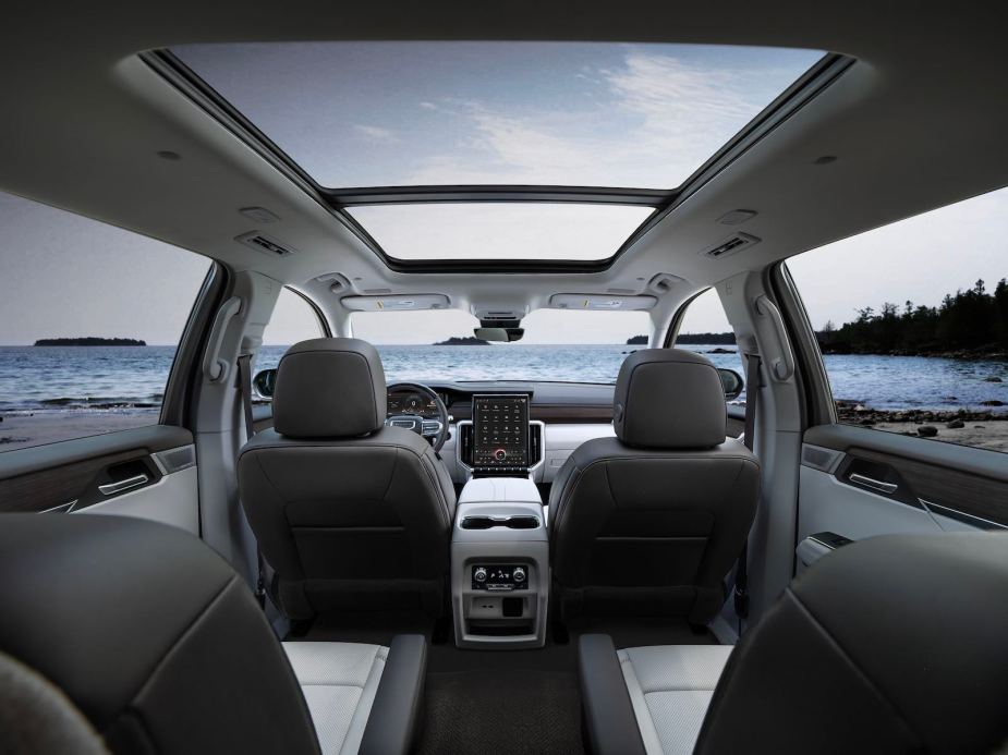 The leather interior of a 2024 GMC Acadia with a sunroof.