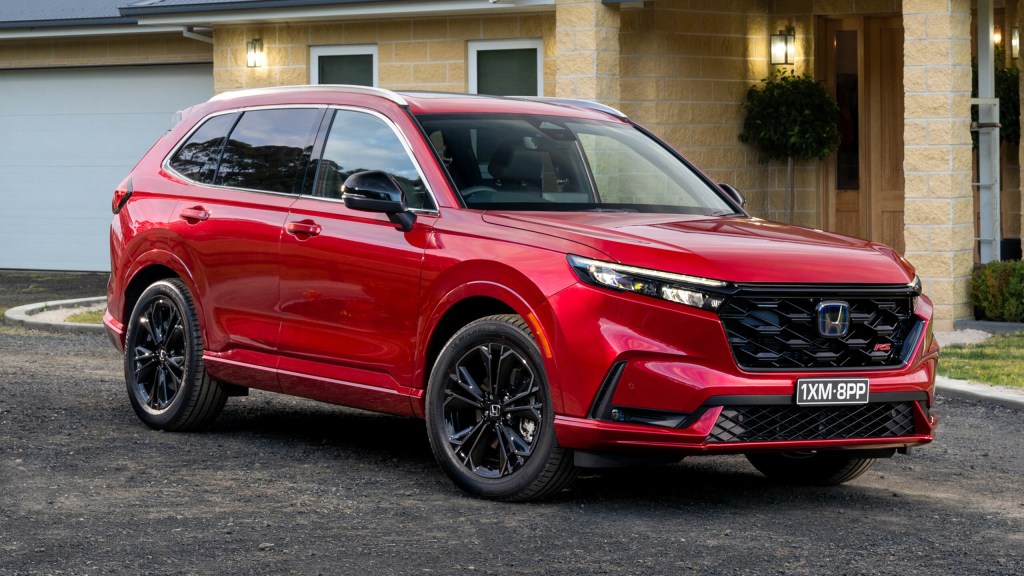 The 2024 Honda CR-V parked near a home