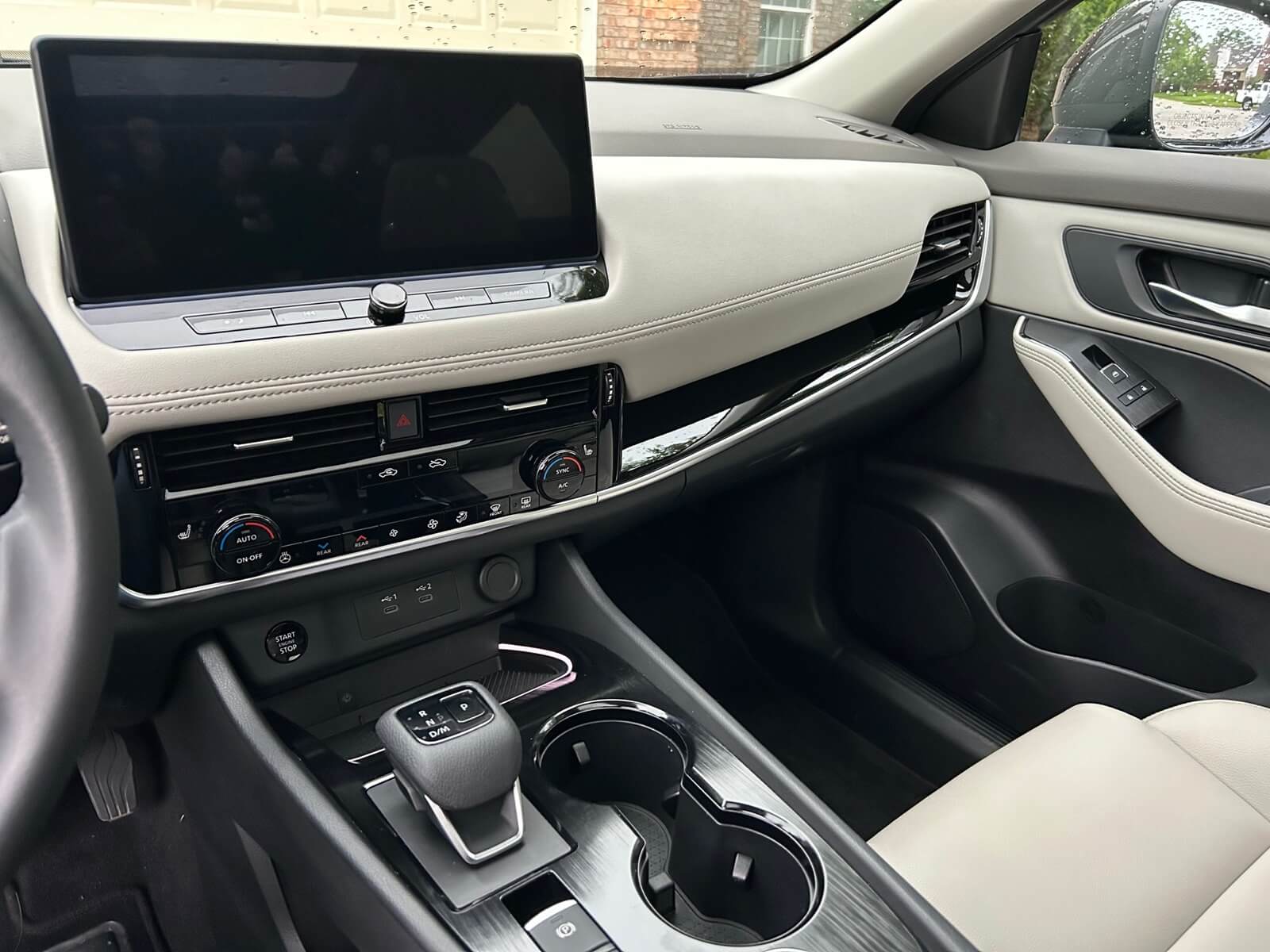 The 2024 Nissan Rogue SL's interior shows off its touchscreen and dual-level dash.