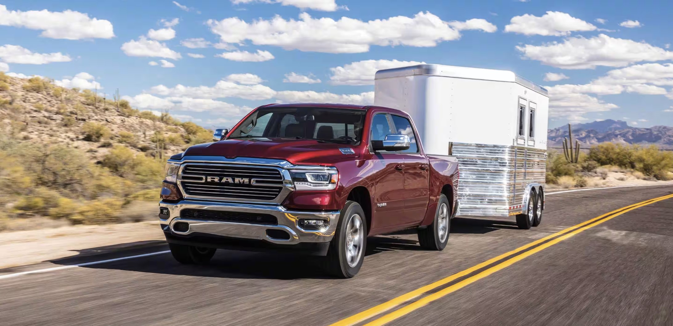 The 2024 Ram 1500 pulling a trailer