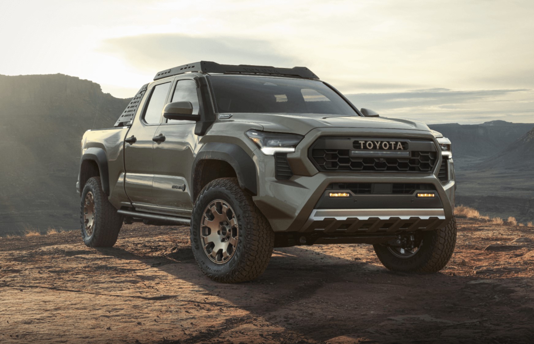 The 2024 Toyota Tacoma climbing over rocks