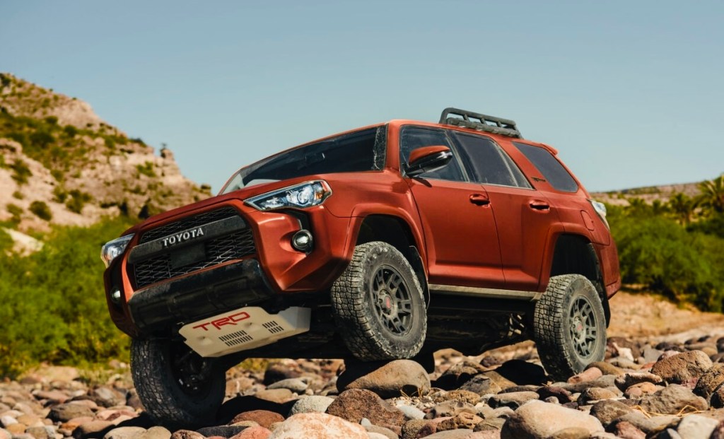 The 2024 Toyota 4Runner climbing over rocks