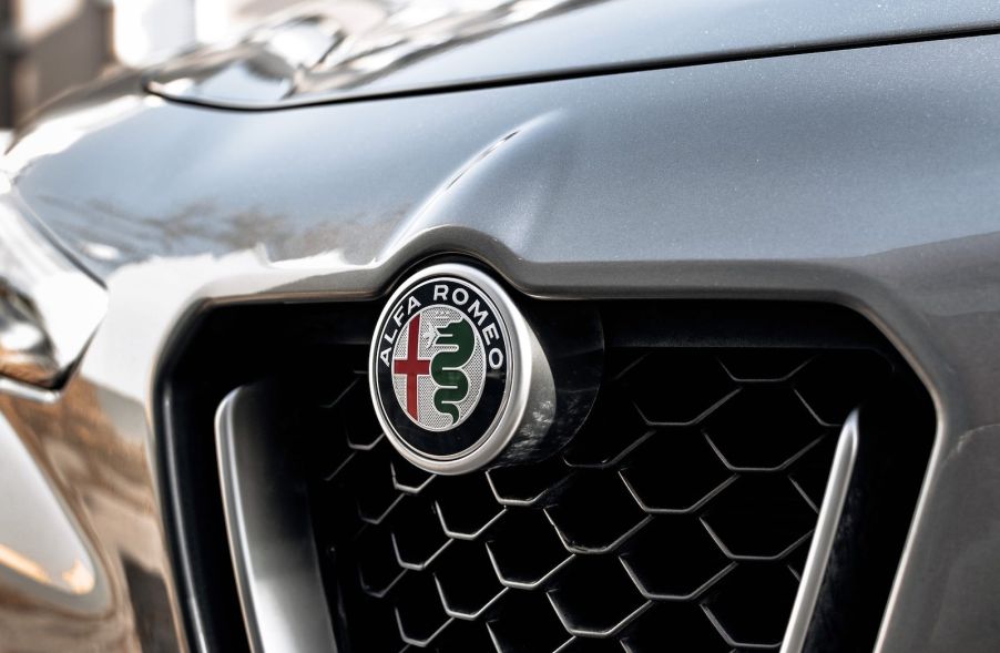 Alfa Romeo logo above the grille on a silver gray cr.