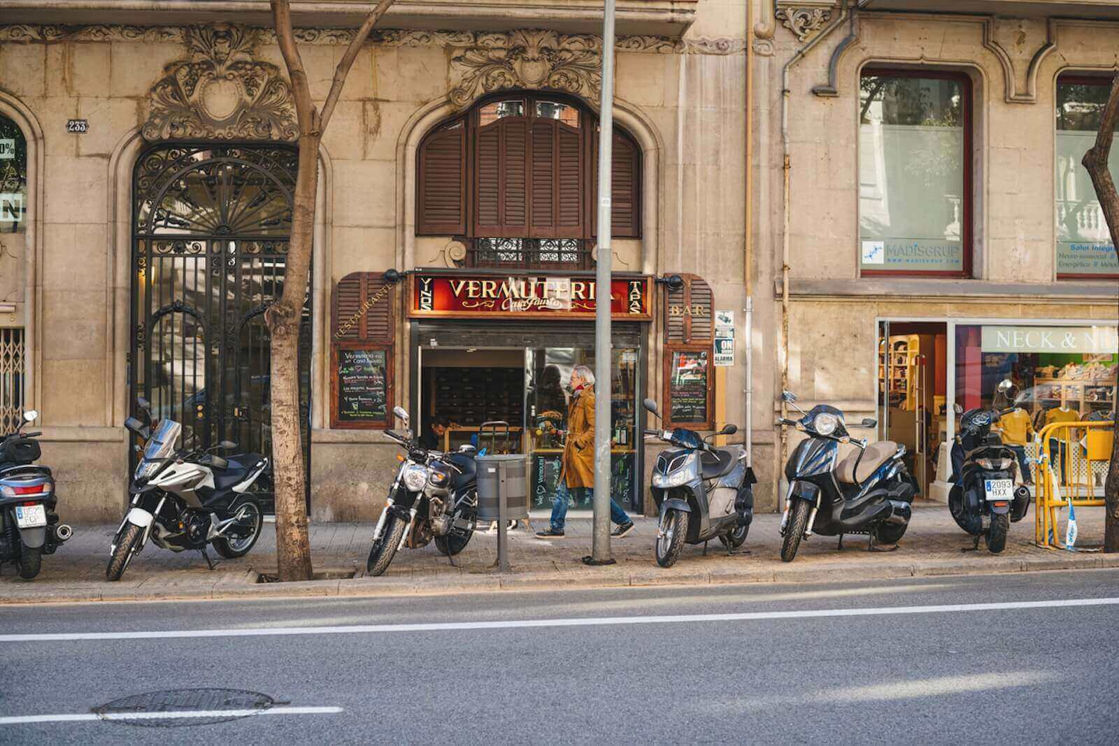 Motorcycles parking on the sidewalk in Barcelona don't interfere with pedestrians. 