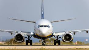 A Ryanair Boeing 737 sits on the tarmac awaiting takeoff.