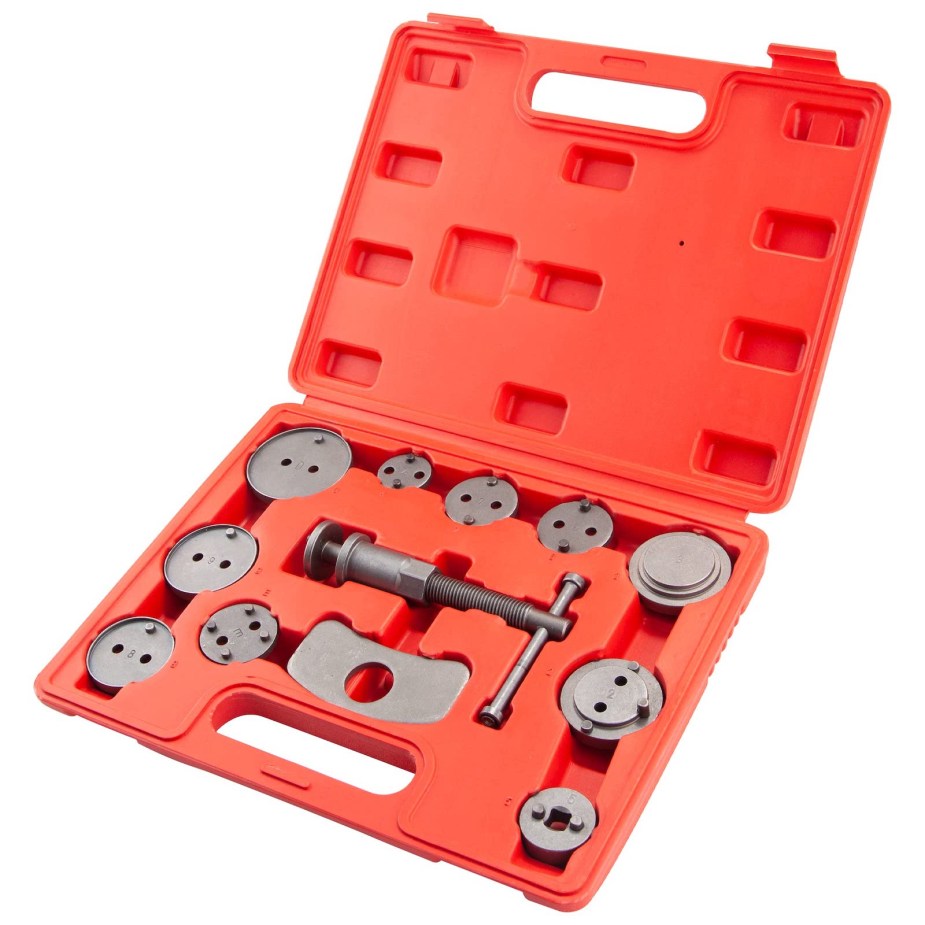 Tool kit in a red plastic box, in front of a white backdrop.