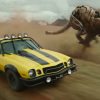 A yellow and black Bumblebee Camaro drives off road in 'Transformers: Rise of the Beasts'.