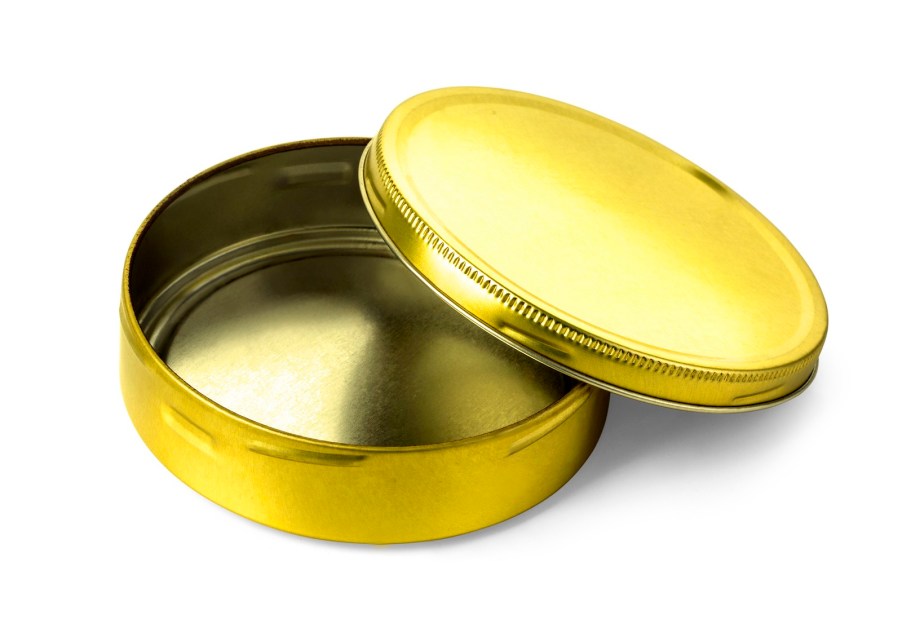 A golden colored empty metal tin with its top off, sitting on a white background.