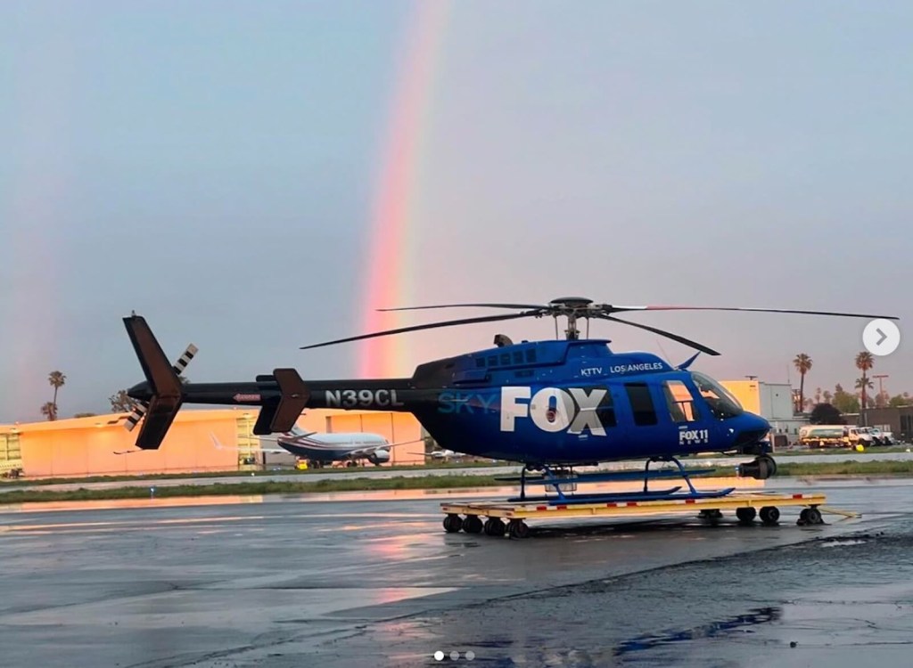 The Fox 11 SkyFOX Helicopter next to a rainbow.