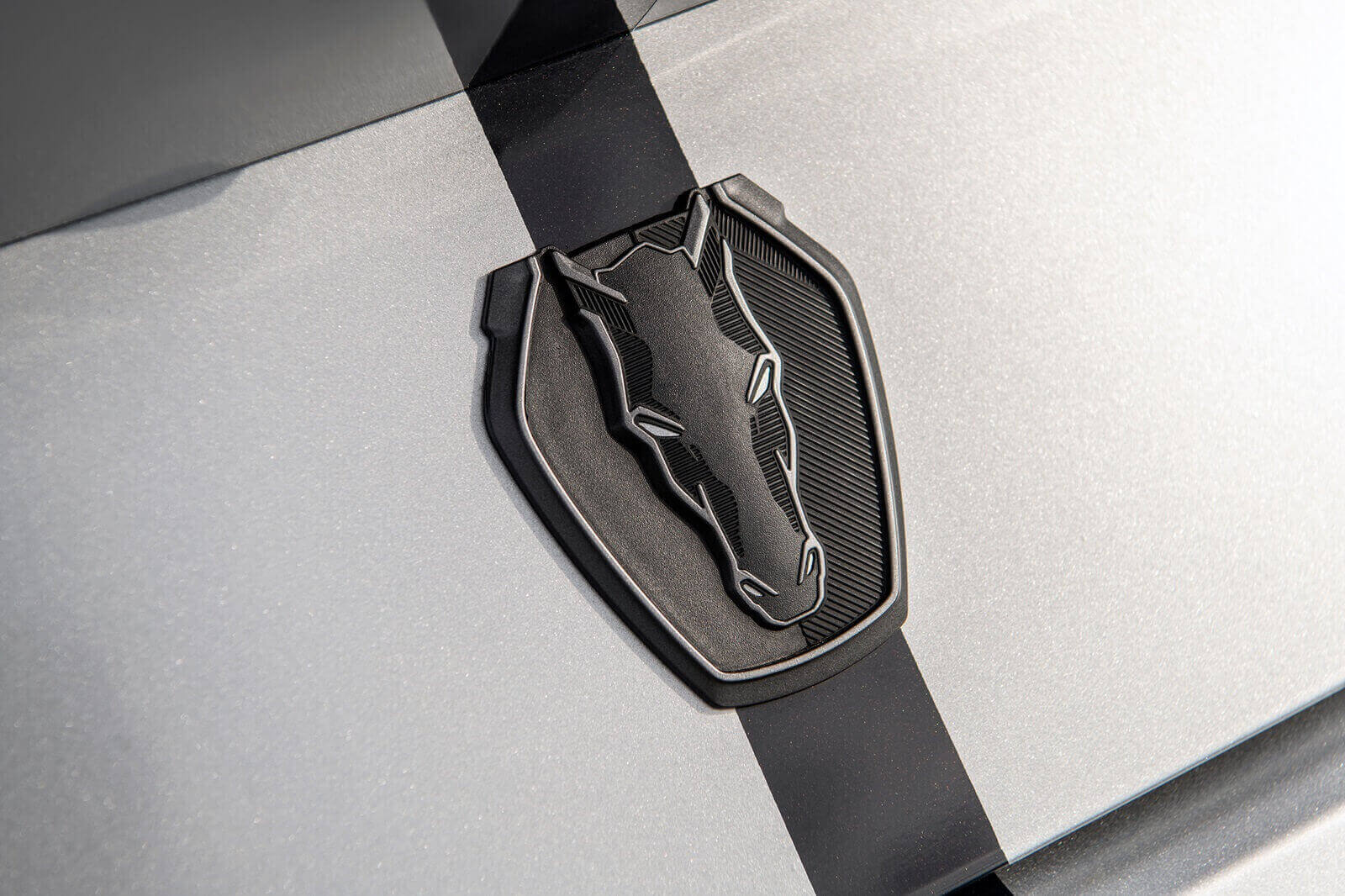 A Hennessey H850 Mustang Dark Horse flashes its badge.