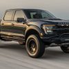 A black Hennessey VelociRaptoR 1000 drives on a test track as the company's latest 'Super Truck'.