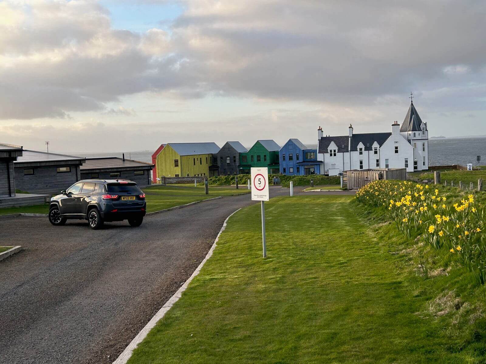 A Jeep Compass driving in Scotland. 