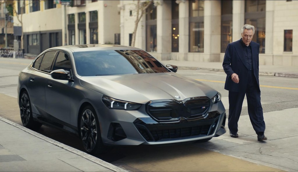 Celebrity Christopher Walken with a BMW car during an advertisement.