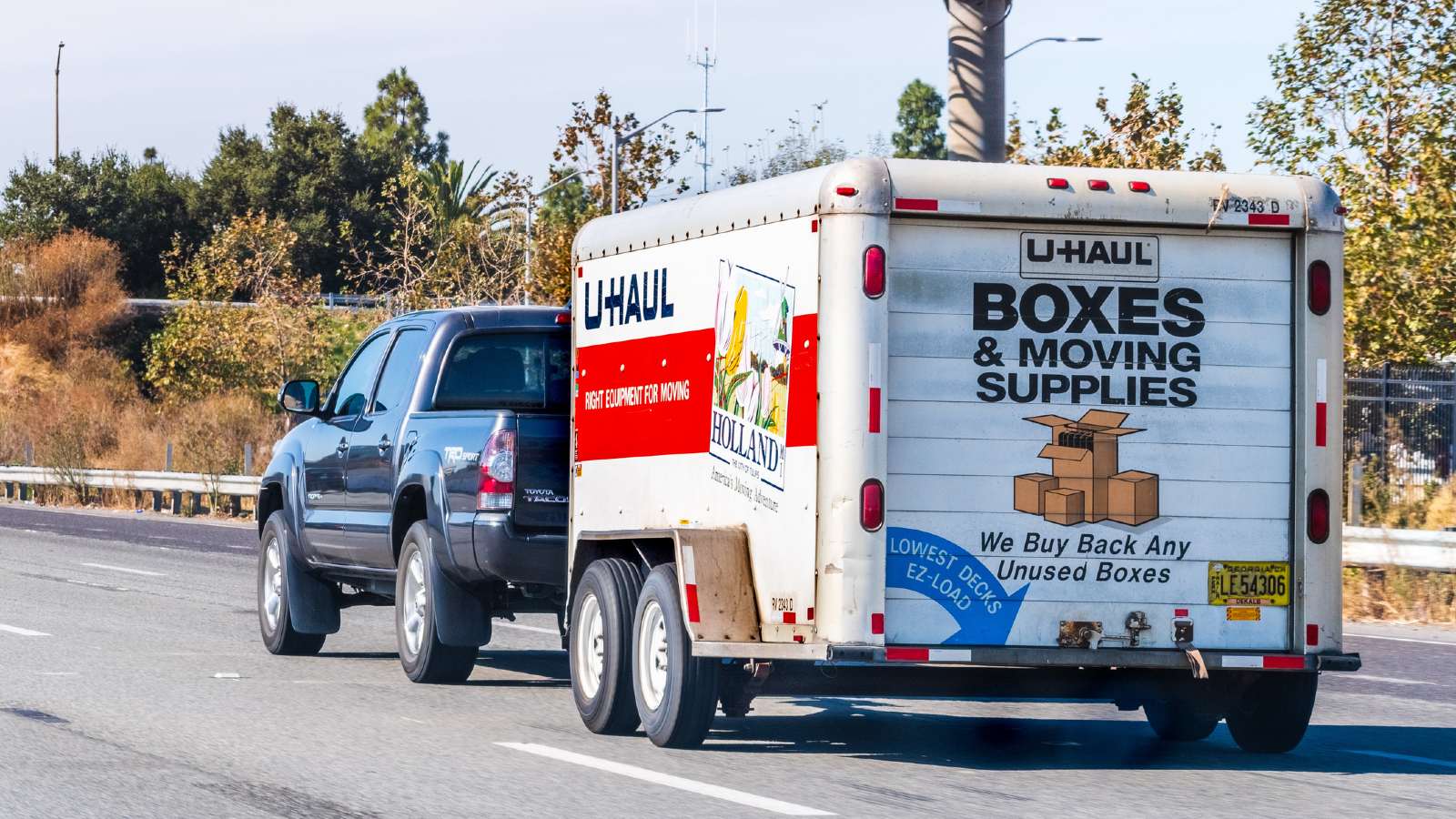Pickup Truck Towing a U-Haul Trailer