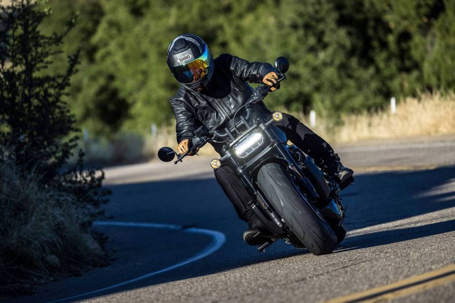 A rider on a Harley-Davidson Sportster S with a new NEOTEC II full-face motorcycle helmet