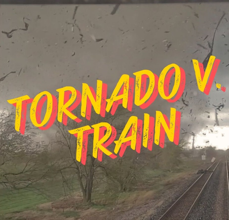 A video shows a tornado as it hits a train.