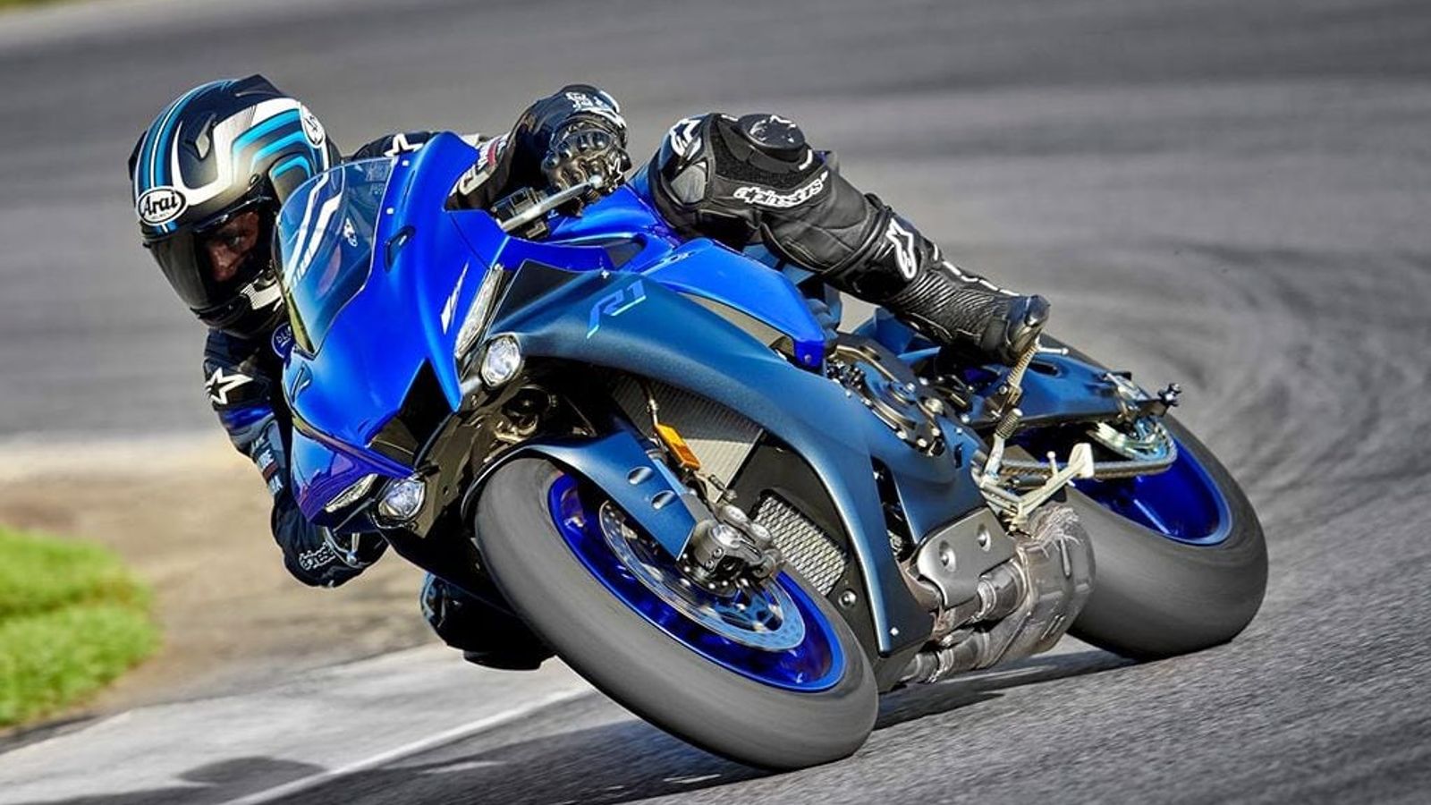 The Yamaha R1 is one of the most legendary motorcycles. Its seen racing at a track.
