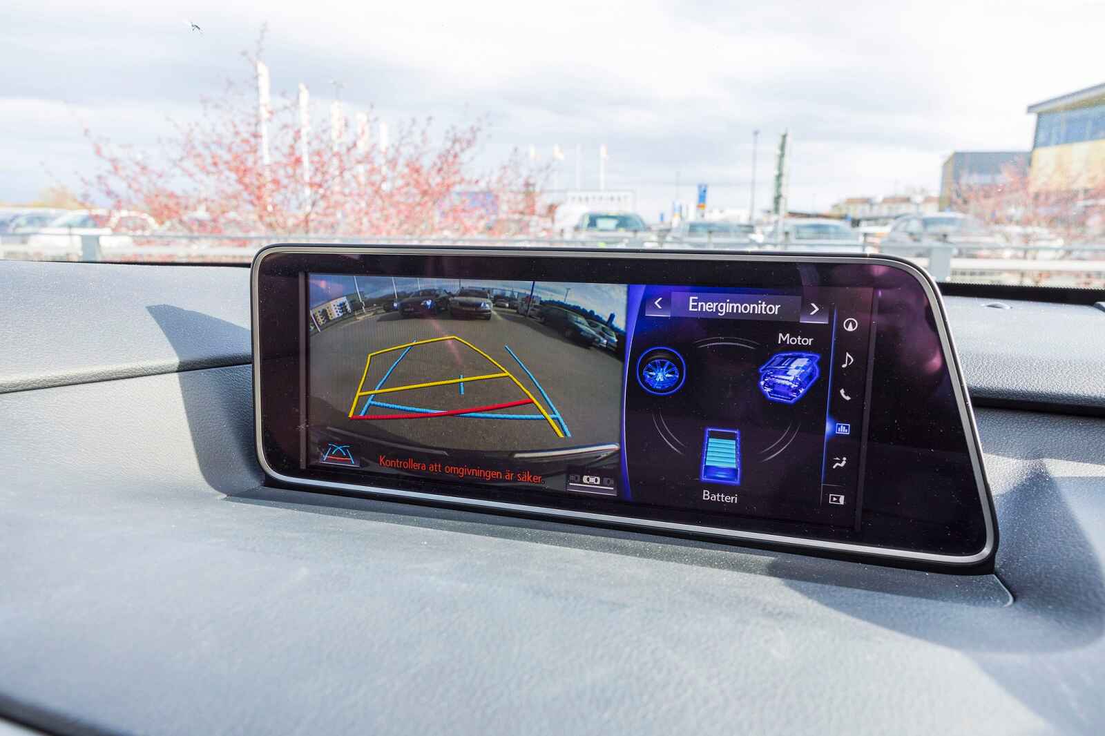 A backup camera on car dash parking lot